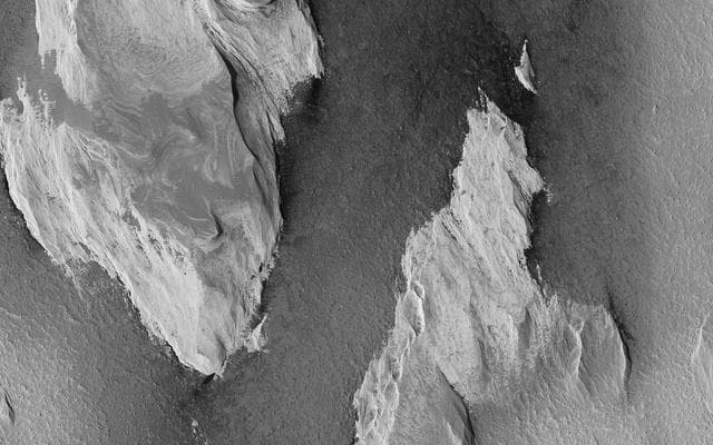 NASA image: Yardangs: Nature's Weathervanes