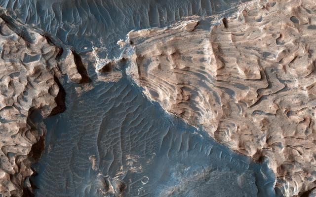 NASA image: Uplifted Blocks of Light-Toned Layered Deposits