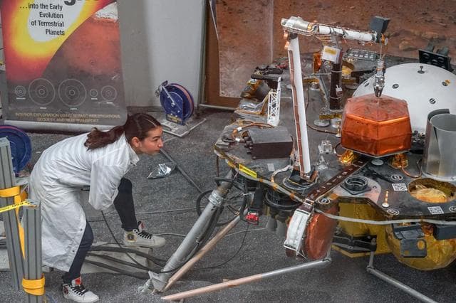 NASA image: Inspecting Instrument Deployment