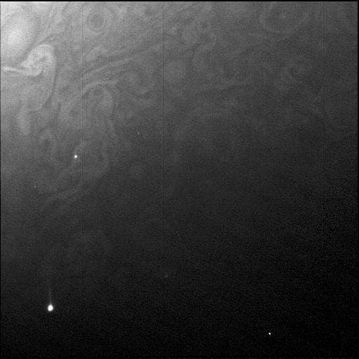 NASA image: Dark Side Courtesy of Jupiter's Moon