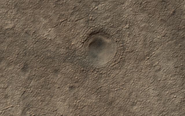 NASA image: A Crater on the South Polar Layered Deposits