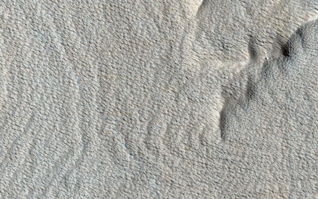 NASA image: Rhythmic Layers East of Medusae Fossae