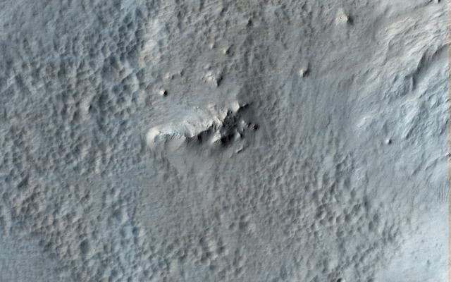 NASA image: Pitted Material from Tooting Crater