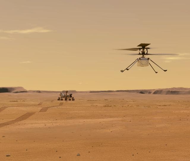 NASA image: Helicopter Above Perseverance on Mars