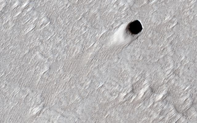 NASA image: Pit Craters and Giant Volcanoes