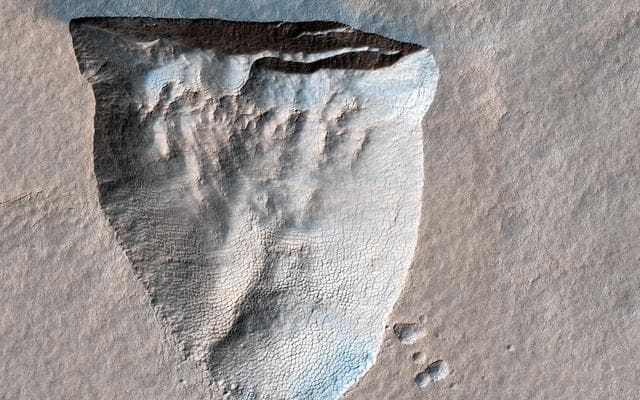 NASA image: An Icy Scarp in the Southern Mid-latitudes