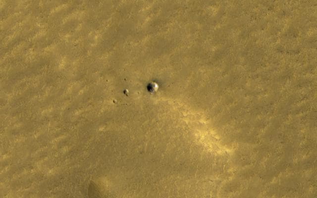 NASA image: Long-lasting Ice in a Young Crater