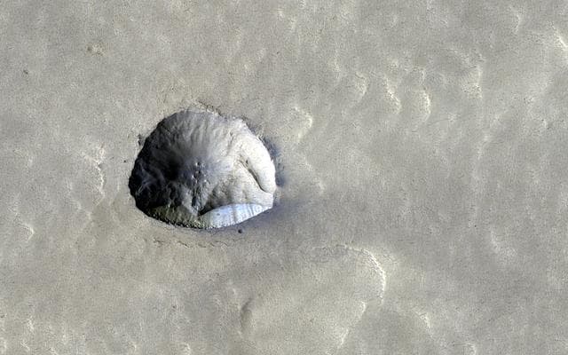NASA image: Icy Cliffs and Impact Craters