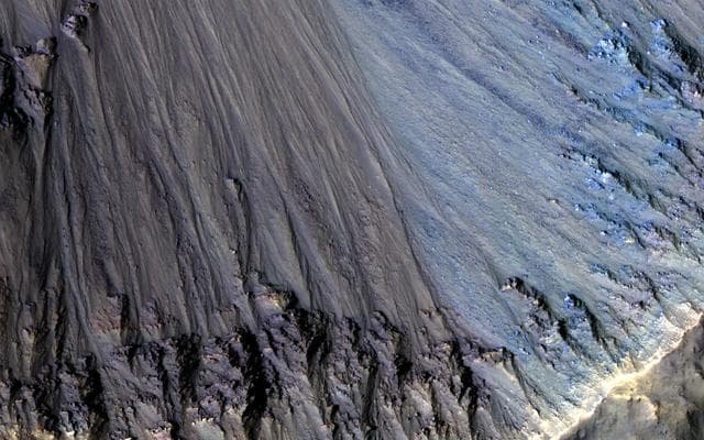 NASA image: Colorful Rocks Exposed in a Fresh Impact Crater