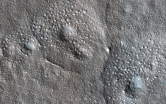 NASA image: Bumpy, Expanded Craters