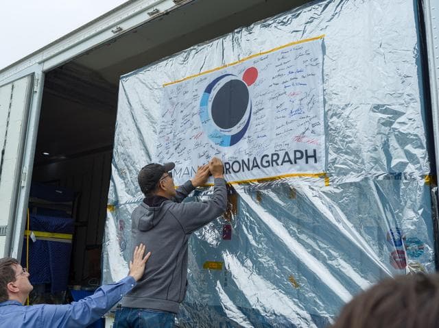 NASA image: Coronagraph Team Signs Flag Farewell
