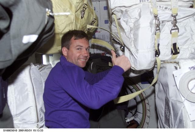 NASA image: MS Lonchakov gives a thumbs up on the middeck of Endeavour