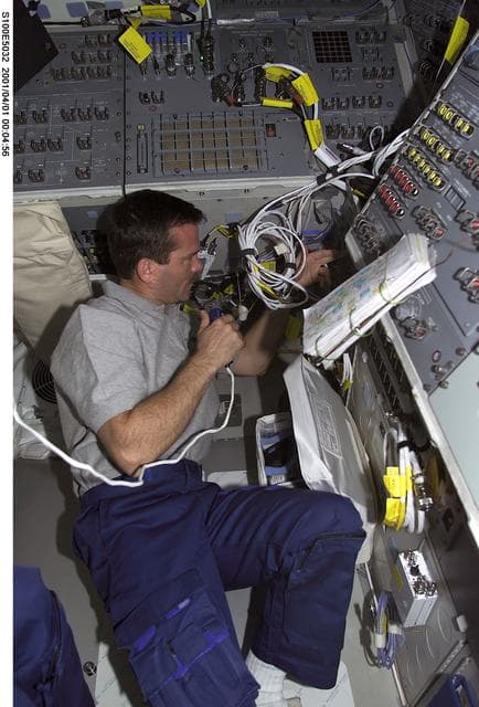 NASA image: MS Hadfield checks rendezvous and communications gear on the aft flight deck of Endeavour