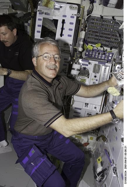 NASA image: MS Phillips prepares to eat on the middeck of Endeavour