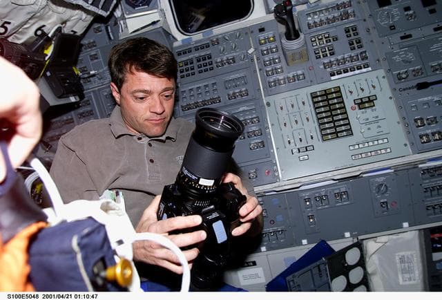 NASA image: Pilot Ashby prepares to use a Hasselblad camera on the aft flight deck of Endeavour