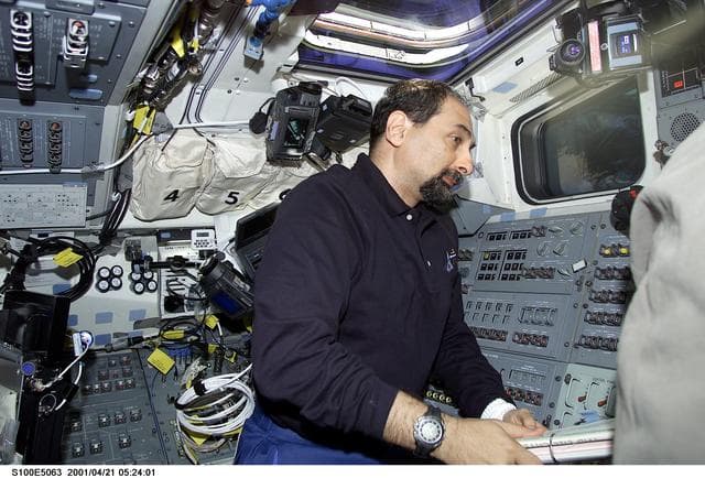 NASA image: MS Guidoni works on the flight deck of Endeavour