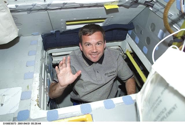 NASA image: MS Lonchakov waves while standing in the interdeck hatch of Endeavour