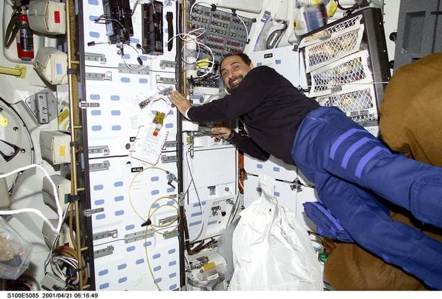 NASA image: MS Guidoni drifts by the galley on the middeck of Endeavour