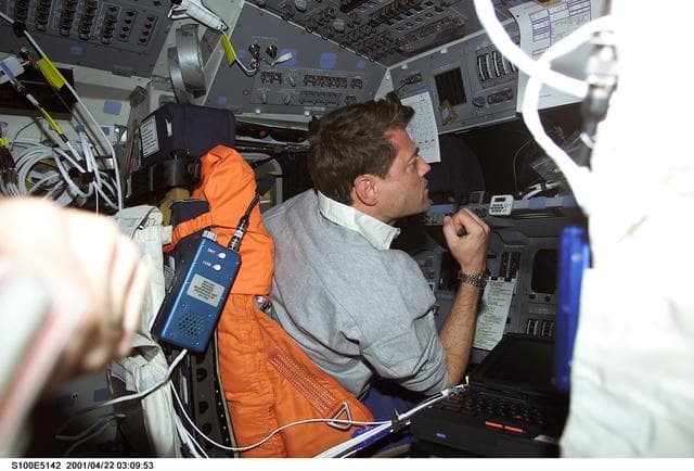 NASA image: Pilot Ashby works at the commander's workstation on the flight deck of Endeavour