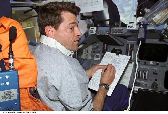NASA image: Pilot Ashby reviews a checklist at the commander's workstation on the flight deck of Endeavour