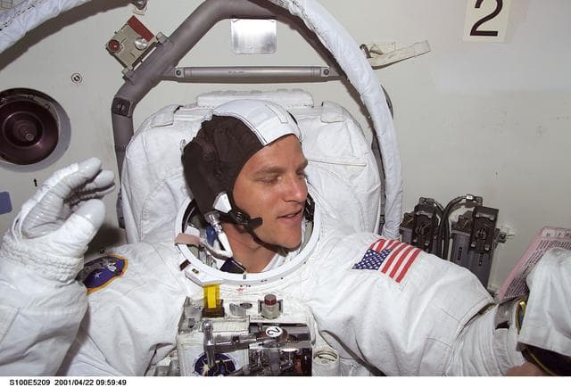 NASA image: MS Parazynski prepares for the first EVA of STS-100 in the airlock of Endeavour