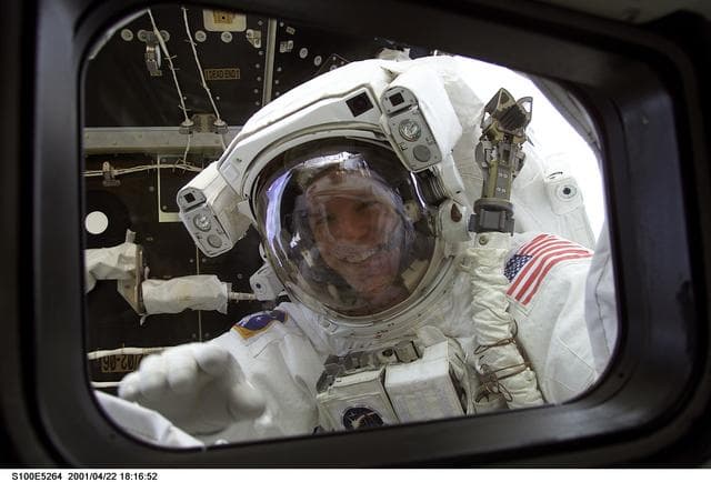 NASA image: MS Parazynski looks in on his fellow crewmembers during the first EVA of STS-100