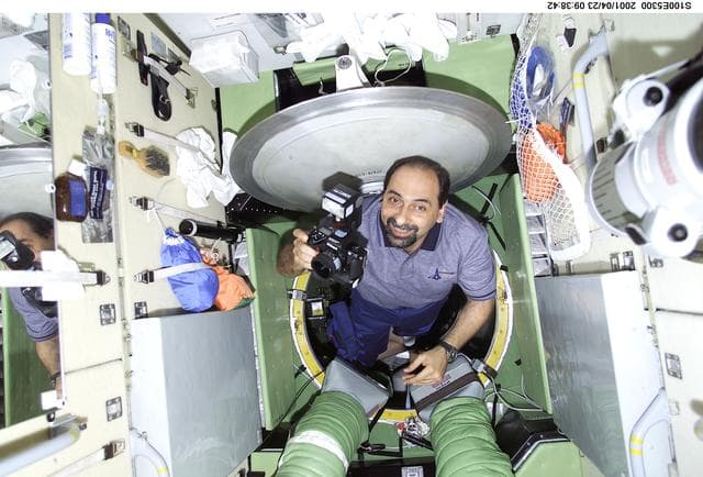 NASA image: MS Guidoni drifts through Zarya with a 35mm camera