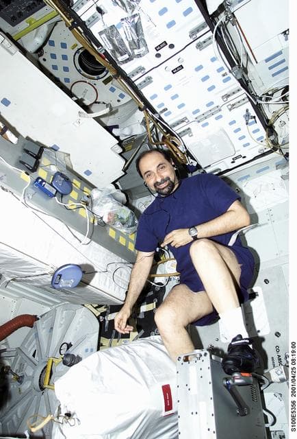 NASA image: MS Guidoni exercises on the cycle ergometer on the middeck of Endeavour