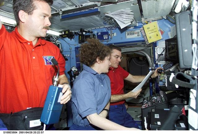 NASA image: Hadfield, Helms and Voss work on the SSRMS controls in Destiny