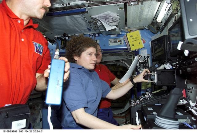 NASA image: Hadfield, Helms and Voss work on the SSRMS controls in Destiny