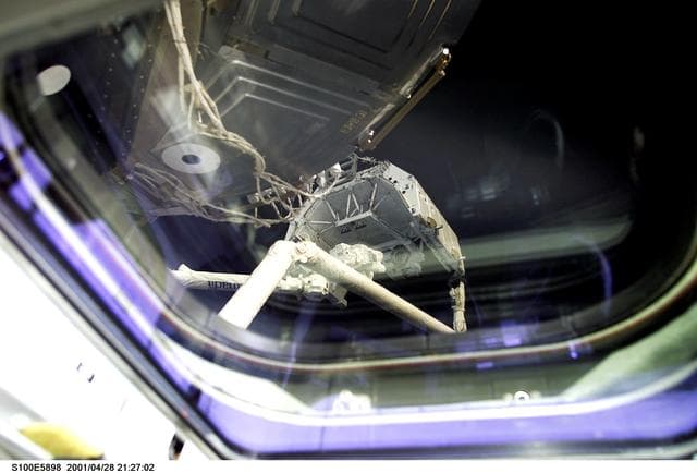 NASA image: View of the "handshake" of the SLP between the SSRMS and RMS during STS-100