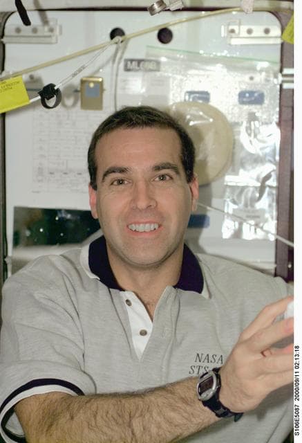 NASA image: MS Mastracchio poses for a photo aboard Atlantis during STS-106