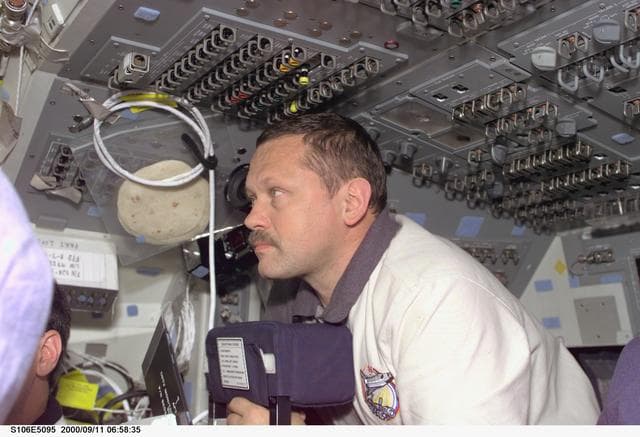 NASA image: MS Morukov works on the aft flight deck of Atlantis during STS-106