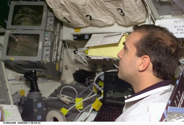 NASA image: MS Mastracchio operates the RMS on the flight deck of Atlantis during STS-106