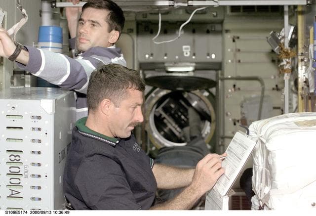 NASA image: MS Burbank and MS Malenchenko working in Zvezda during STS-106