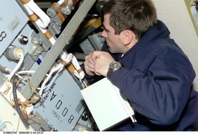 NASA image: MS Malenchenko conducts electrical work in Zvezda during STS-106