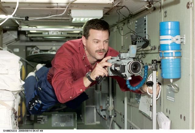 NASA image: Pilot Altman sets up a camcorder in Zvezda during STS-106