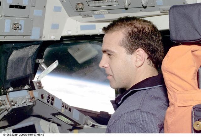 NASA image: MS Mastracchio works at the pilot's workstation in Atlantis during STS-106