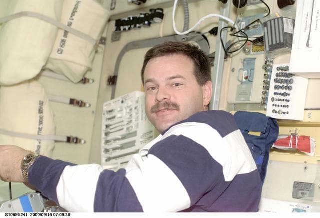 NASA image: Pilot Altman at work in Zvezda during STS-106