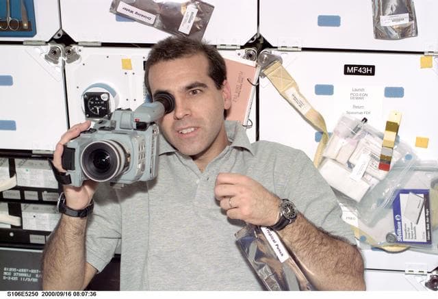 NASA image: MS Mastracchio operates a camcorder on Atlantis during STS-106