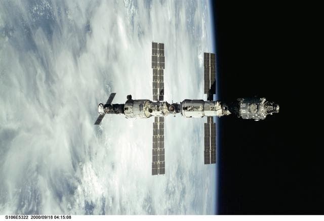NASA image: View of the ISS as Atlantis makes its closing fly around during STS-106