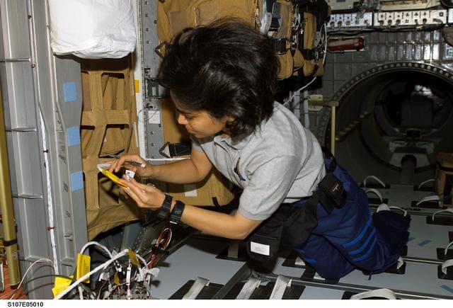 NASA image: Chawla in the Spacehab RDM during activation procedures during STS-107