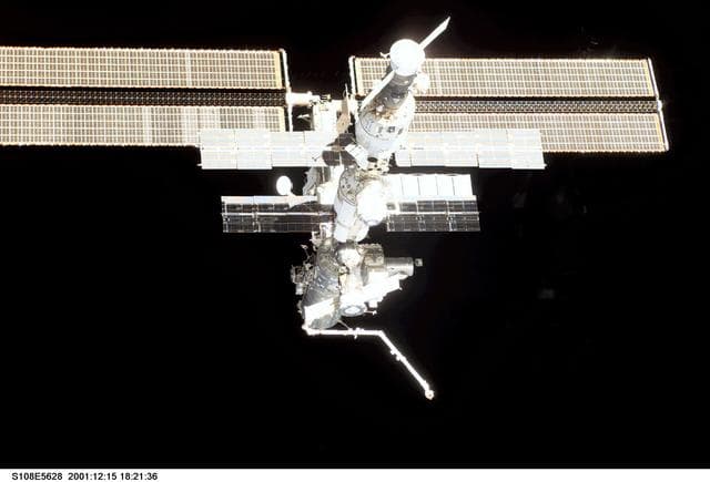 NASA image: The nadir - aft side of the ISS taken during the STS-108 undocking and flyaround