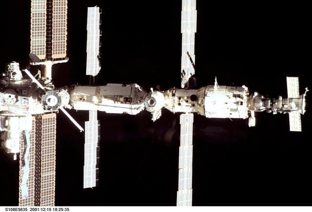 NASA image: The nadir side of the ISS taken during the STS-108 undocking and flyaround