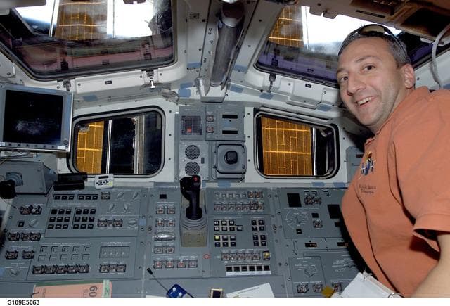 NASA image: STS-109 MS Massimino smiles for camera from aft flight deck