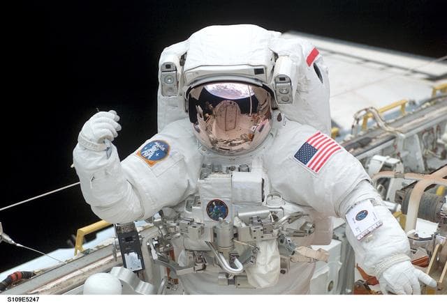 NASA image: STS-109 MS Grunsfeld in payload bay during first EVA