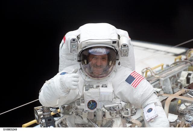NASA image: STS-109 MS Grunsfeld in payload bay during first EVA