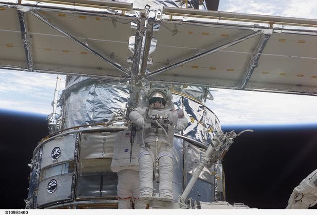 NASA image: View of STS-109 MS Linnehan and Grunsfeld during EVA 1