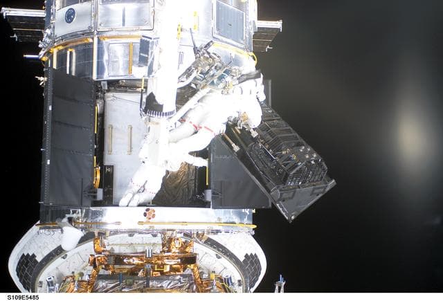 NASA image: STS-109 MS Newman and Massimino during EVA 4