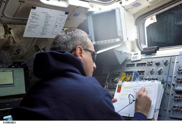 NASA image: MS Linnehan watches EVA 2 from aft flight deck